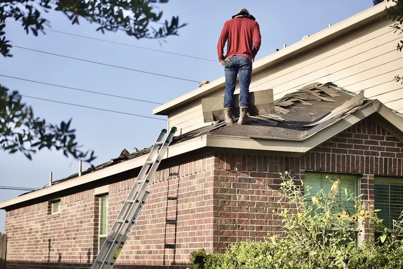 Professional roofer working on a residential roof in Serrano Highlands